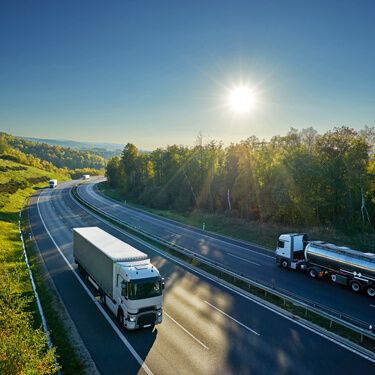 Freight Shipping from Texas to California - Trucks on highway on sunny day