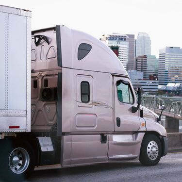 Freight Shipping from Texas to Massachusetts - Side of light brown truck cab