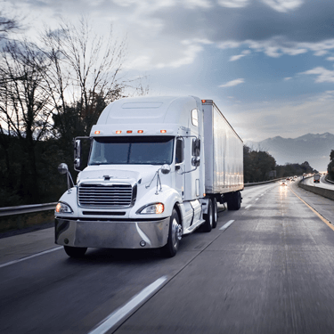 Freight Shipping from Ohio to Florida - White freight truck in right lane of two lane highway