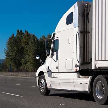 Freight Shipping from Pennsylvania to Florida - Side view of truck on highway