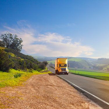 Freight Shipping from New Jersey to California - Yellow truck on road