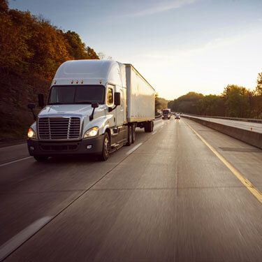 Freight Shipping from New Jersey to Texas - White truck in right lane