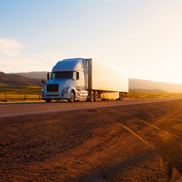 Freight Shipping from New Jersey to Texas - White truck on road by fields