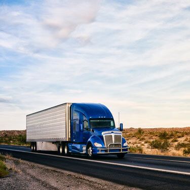 Shipping from Washington to Texas - Blue truck on road