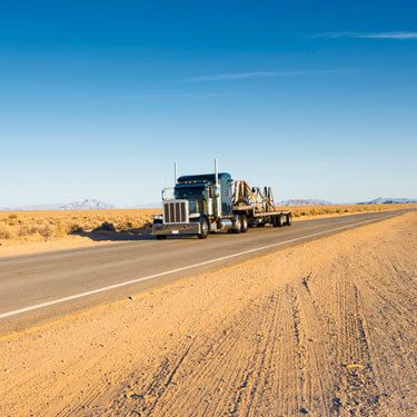 Shipping from Washington to Texas - Truck on road with blue and white horizon