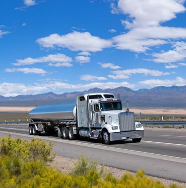 Freight Shipping from Utah to Alabama - Hazmat carriers truckload shipping white semi fuel tanker