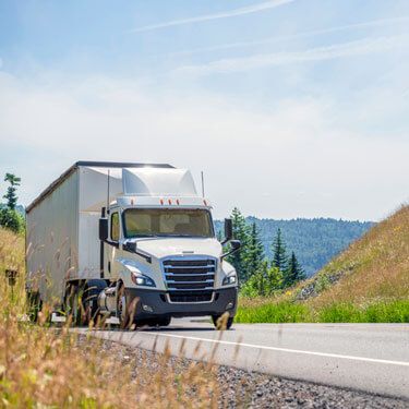 Freight Shipping from Utah to Ohio - White truck on scenic road