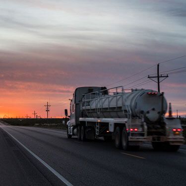 Freight Shipping from North Carolina to Texas - Truck on road with dark cloudy sky