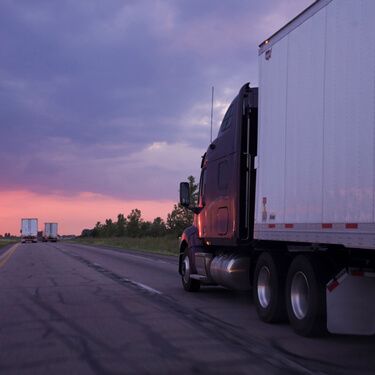 truck on highway at sunset