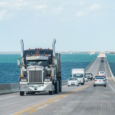 Freight Shipping from Oregon to Florida - Bridge view of truck along highway