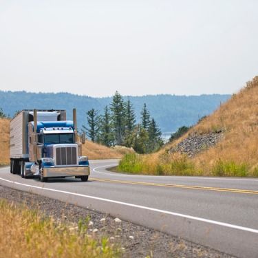 Freight Shipping from Washington DC to Philadelphia - Blue truck on scenic road