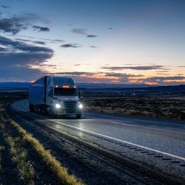 Freight Shipping from Washington DC to Virginia - Long haul semi truck with headlights on