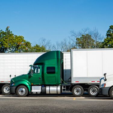 Shipping Freight From Maine to Florida - Side view of green truck cab