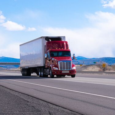 Shipping Freight from Wyoming to Florida - Red semi on highway