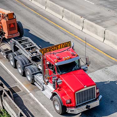 oversize-freight-red-truck on highway