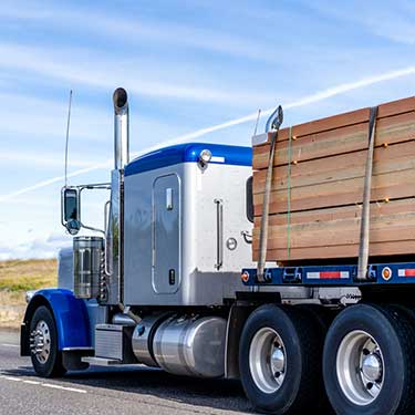 Shipping from Washington to Alaska - Flatbed silver blue truck