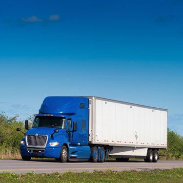 Freight Shipping from Tennessee to California - Blue freight truck under clear blue sky