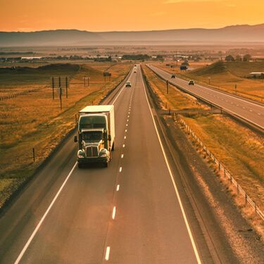 Shipping freight from Wyoming to California - Truck on Road at Sunset