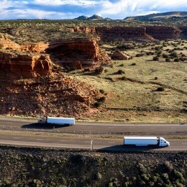 Freight Shipping from Arizona to Alaska - Aerial View of Semi Trucks on the Highway