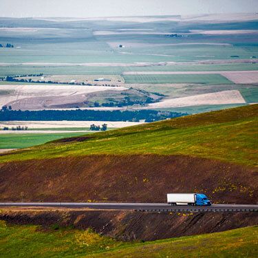 Freight Shipping from California to New York - Freight Trucks traveling on highway