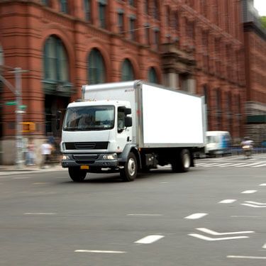 cargo truck driving through downtown Newe Y