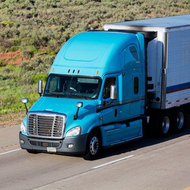 Freight Shipping from Utah Blue Semi Truck on the Highway