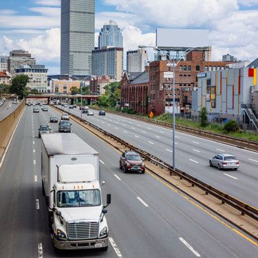 freight-shipping-from-massachusetts-to-massachusetts-semi-truck-on-busy-city-highway