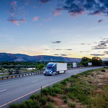 Freight Shipping from Ohio to California - Blue truck on highway