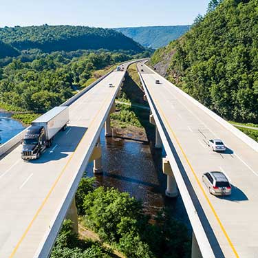 Freight Shipping from Pennsylvania Semi trucks traveling on Highway