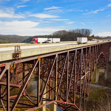 Freight Shipping from West Virginia to California - Trucks on Bridge