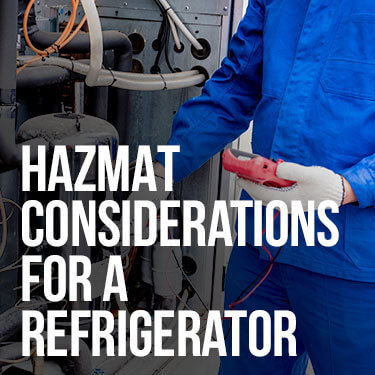 A technician checks inside of a refrigerator