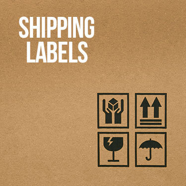 The side of a cardboard box with hazard symbols