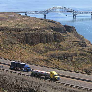 Shipping from Washington - Freight Trucks Traveling on Highway