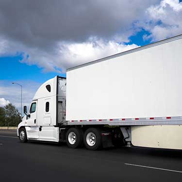 Freight Shipping from Georgia to California - Side view of white truck