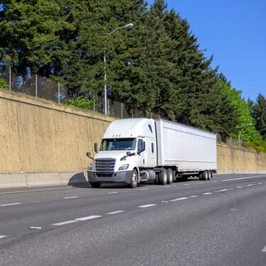 Shipping Freight From Maine to Florida - White semi-truckload on highway