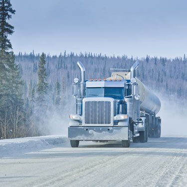 tanker semi-truck on iced Alaskan road