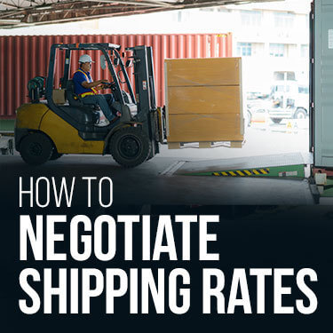 A forklift placing a pallet into a trailer on a loading dock